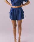Chaser Rileyy Honest Indigo Shorts front cropped view highlighting elastic waist and cargo pockets