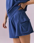 Chaser Rileyy Honest Indigo Shorts side detail close up focusing on cargo pocket design