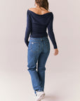 Navy off-the-shoulder long sleeve top with fitted body and sleeves.