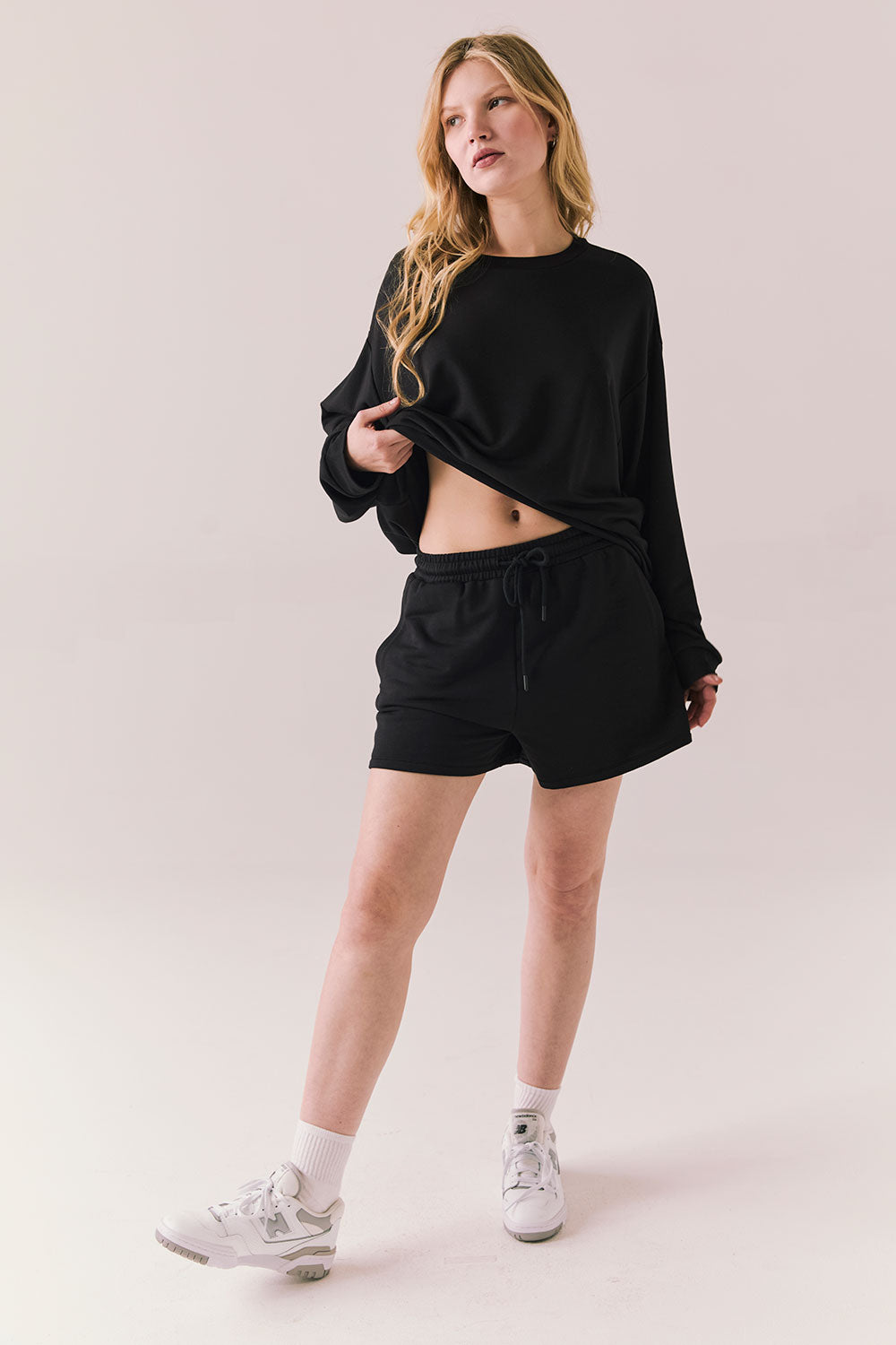 Black drawstring lounge shorts made from soft pillow terry.