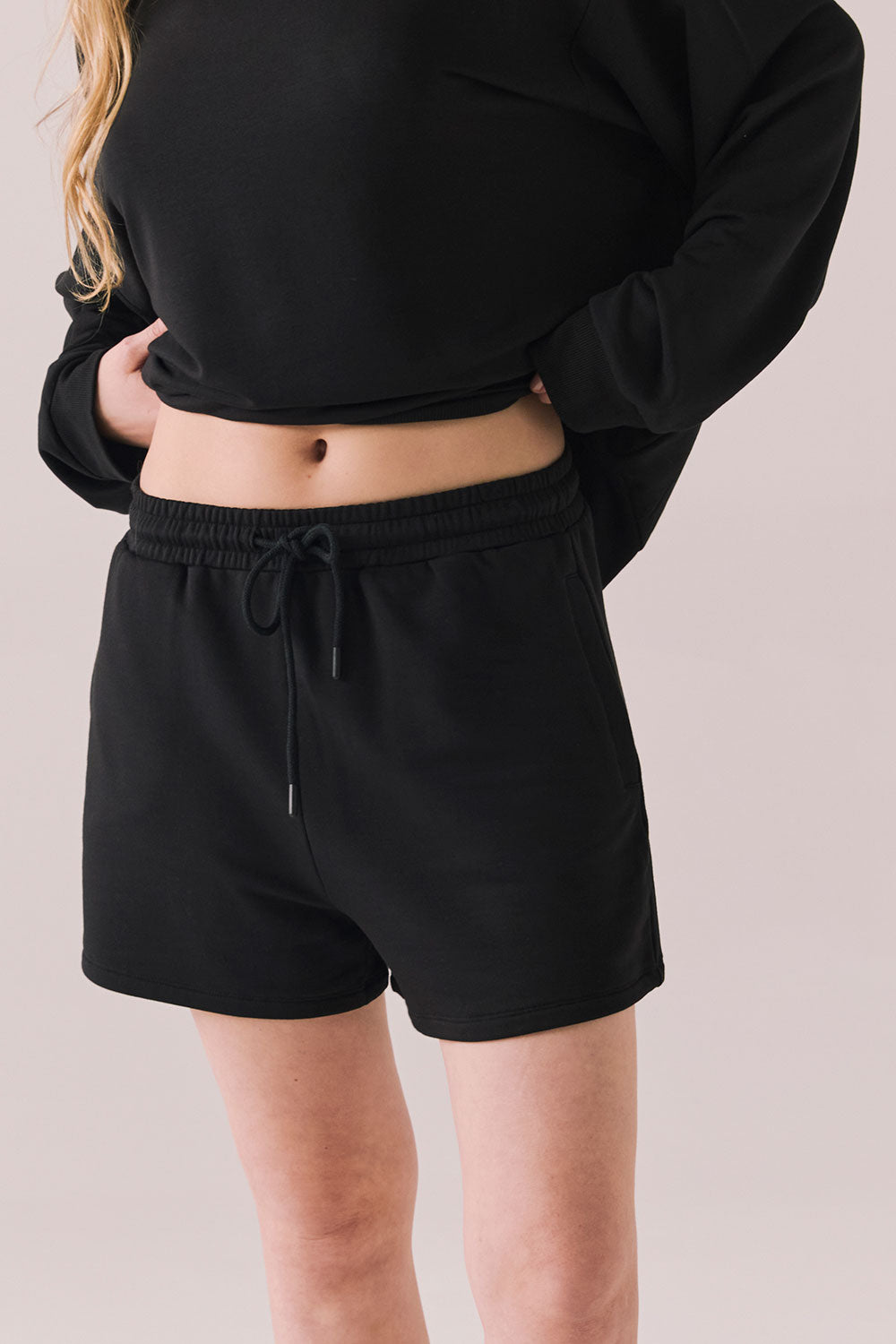 Black drawstring lounge shorts made from soft pillow terry.