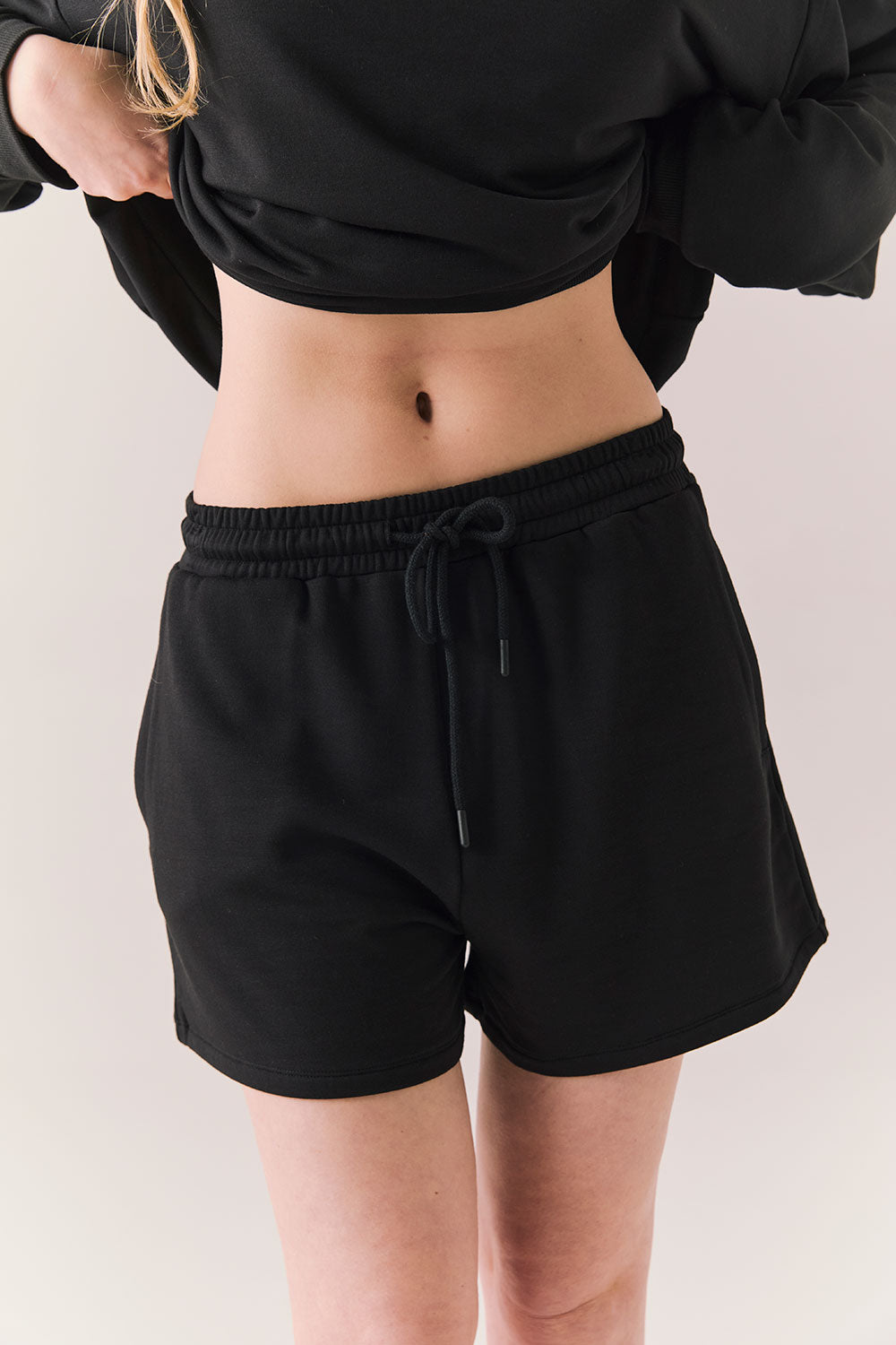 Black drawstring lounge shorts made from soft pillow terry.
