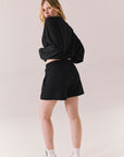 Black drawstring lounge shorts made from soft pillow terry.