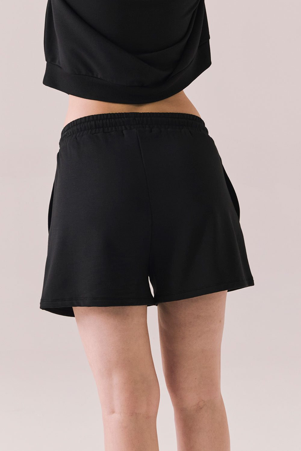 Black drawstring lounge shorts made from soft pillow terry.