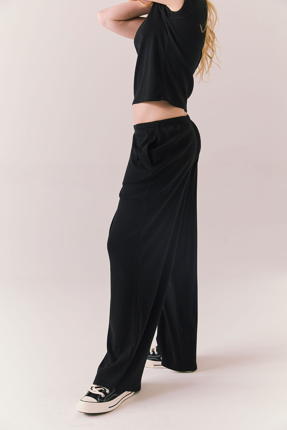 True black fleece joggers with side pockets and relaxed silhouette.