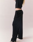 True black fleece joggers with side pockets and relaxed silhouette.