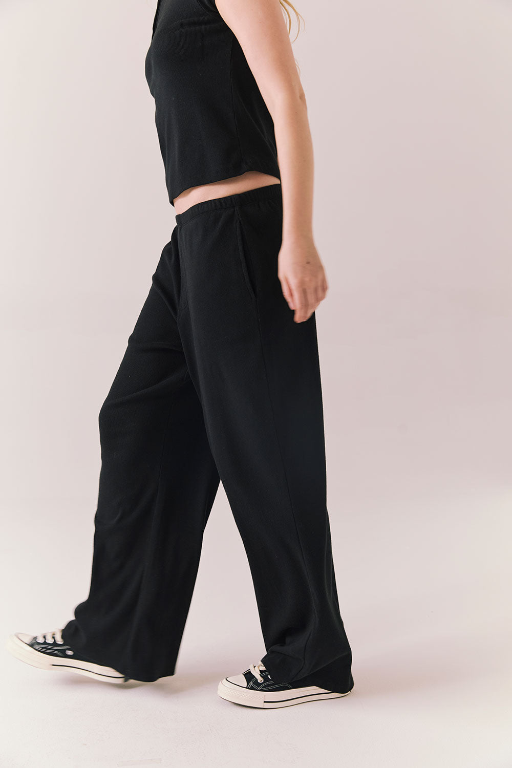 True black fleece joggers with side pockets and relaxed silhouette.