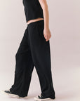 True black fleece joggers with side pockets and relaxed silhouette.