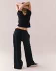 True black fleece joggers with side pockets and relaxed silhouette.