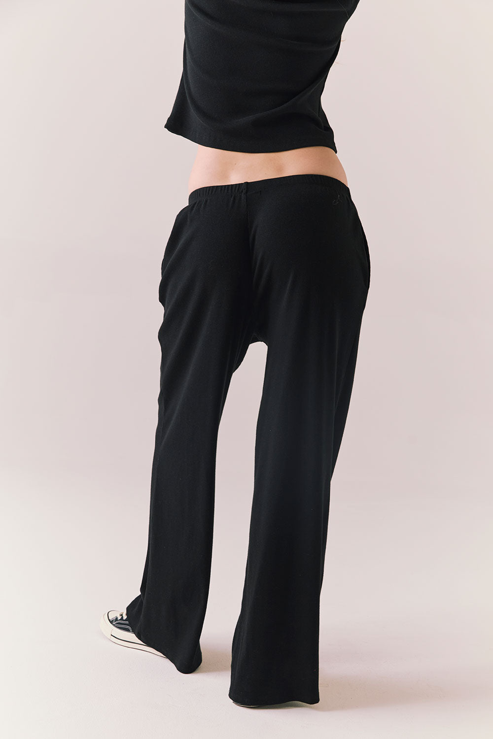 True black fleece joggers with side pockets and relaxed silhouette.