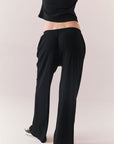 True black fleece joggers with side pockets and relaxed silhouette.