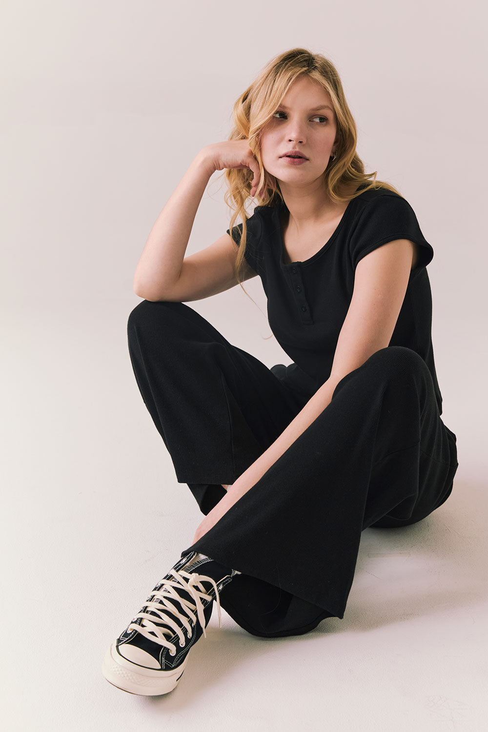 True black fleece joggers with side pockets and relaxed silhouette.
