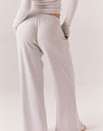 Light heather grey joggers with elastic waistband and relaxed fit, made from recycled fleece.