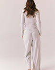 Light heather grey joggers with elastic waistband and relaxed fit, made from recycled fleece.