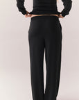 Back of black lounge pants with clean design and flowy silhouette.