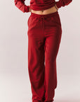 Crimson red lounge trousers with wide leg and relaxed fit front view.