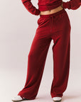 Crimson red lounge trousers with wide leg and relaxed fit front view.