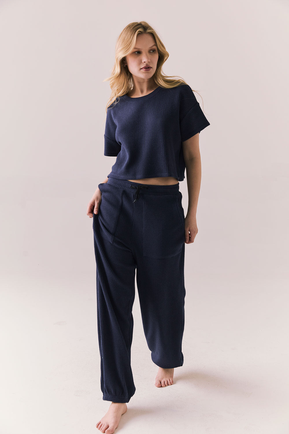 Full front view of model in Irvine Tee in midnight blue with soft thermal texture and matching Billy Joggers against a plain background
