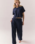 Full front view of model in Irvine Tee in midnight blue with soft thermal texture and matching Billy Joggers against a plain background