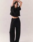 Full front view of model in Irvine Tee in true black with soft thermal texture and matching Billy Joggers