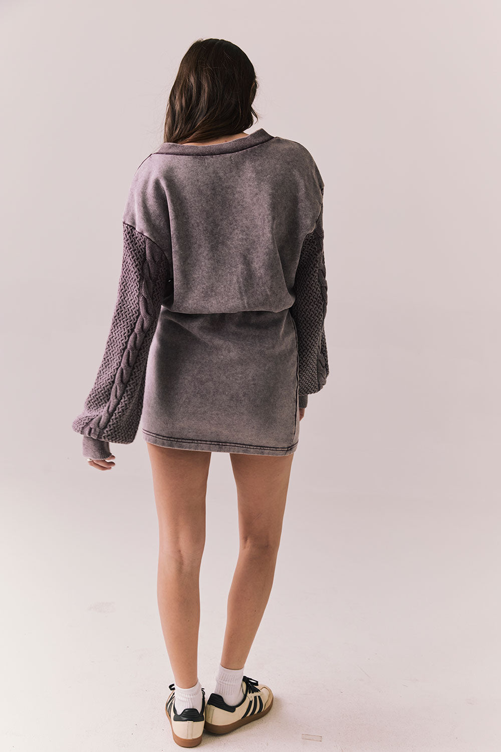 Back full body view of model in fig Channel Mini Dress