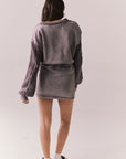 Back full body view of model in fig Channel Mini Dress