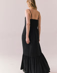 Back full body view of model in Berkeley Maxi Dress in true black