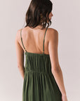 Closeup back of woman wearing the Berkeley Maxi Flowy Silky Dress in Green against a white background