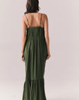 Back of woman wearing the Berkeley Maxi Flowy Silky Dress in Green against a white background