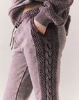 Side view of model wearing Bay Joggers in fig with fleece texture and pocket detail