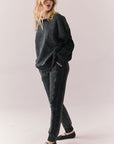 Side full body view of model in Bay Joggers in true black