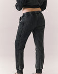 Back view of model wearing Bay Joggers in true black