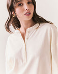 Front view of model wearing the Humboldt long sleeve in starry white with soft cotton texture against a white background