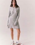 Full front view of model wearing Merced Hoodie Dress in Heather Grey with hood and thermal knit texture against a plain background