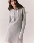 Front view of model wearing Merced Hoodie Dress in Heather Grey with hood and thermal knit texture against a plain background