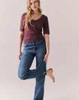 Full front view of Fresno tee in fig with scoop neck and fitted silhouette and denim on a plain background
