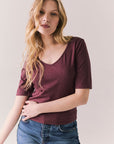 Front view of Fresno tee in fig with scoop neck and fitted silhouette on a plain background