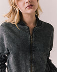 Front view of Fullerton hoodie in True Black with oversized silhouette with black jeans on a plain background