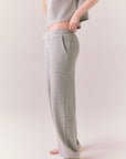 Side view of model wearing Billyy Joggers in heather grey