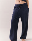 Front view of model wearing Billyy Joggers in midnight blue