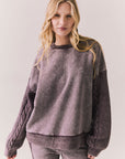Front view of Maritime Pullover in fig (deep purple) with relaxed fit and knit texture against a plain background