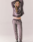 Full front view of Maritime Pullover in fig (deep purple) with relaxed fit and knit texture with matching Bay joggers against a plain background