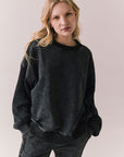 Front view of Maritime Pullover in True Black with relaxed fit and knit texture against a plain background