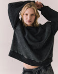 Front view of Maritime Pullover in True Black with relaxed fit and knit texture against a plain background