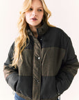Front view of Chaser Brand Whistler Leopard and True Black Puffer Jacket featuring subtle leopard print and color-block design