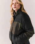 Side angle of Chaser Brand Whistler Leopard and True Black Puffer Jacket highlighting puffed silhouette and high collar