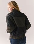 Back view of Chaser Brand Whistler Leopard and True Black Puffer Jacket with contrast panels and elasticized hem