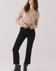 Full body view of woman wearing Chaser’s Sparrow Bronze Brown Long Sleeve button-up with black pants and black boots on a white background