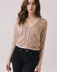 Front view of woman wearing Chaser’s Sparrow Bronze Brown Long Sleeve button-up on a white background