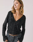 Front view of woman wearing Chaser’s Sparrow True Black Button-Up Long Sleeve on a white background